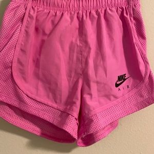 Pink Nike Dri-Fit running shorts